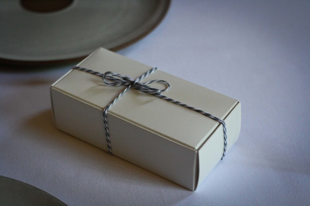 Box containing black and white cookies