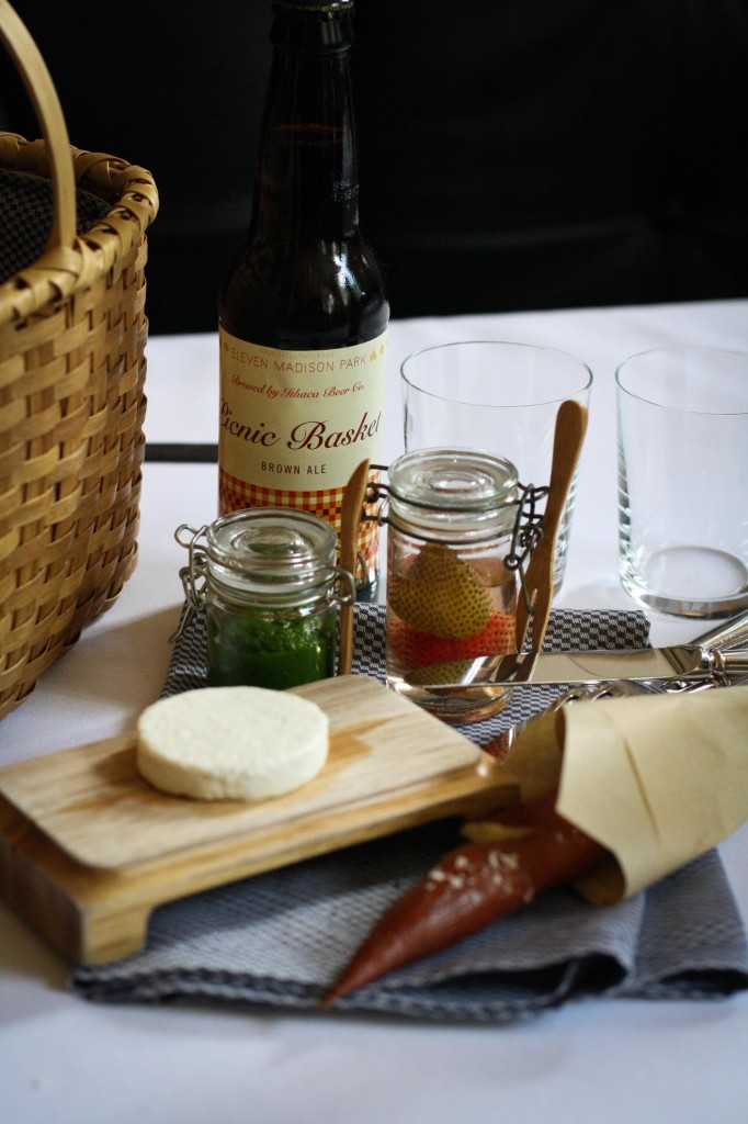 Picnic Basket with pretzel, beer, cheese, parsley puree and pickled strawberries