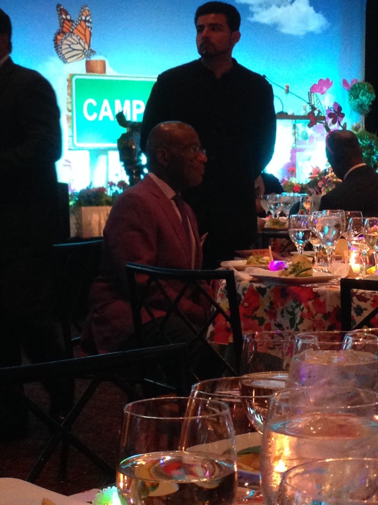 Al Roker getting ready to present in his finest purple smock.