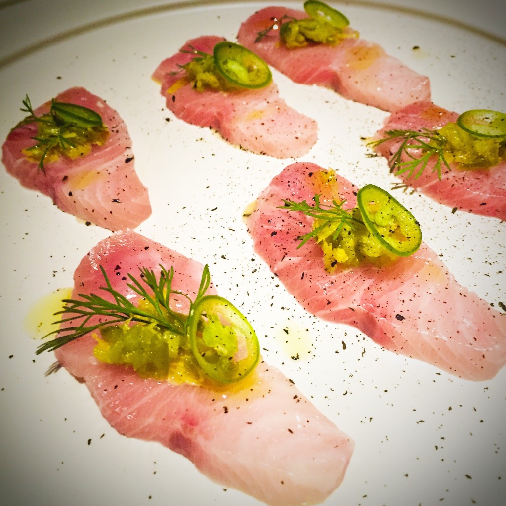 Sliced Raw Hamachi fermented jalapeños, black limes - $19