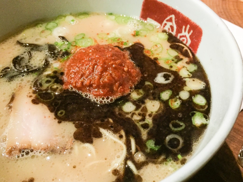 Karaka Men -  $15 The original silky “Tonkotsu” (pork) soup noodles with Ippudo’s special blend of hot spices, topped with pork chashu, sesame kikurage mushrooms, onion, minced pork, and scallions.