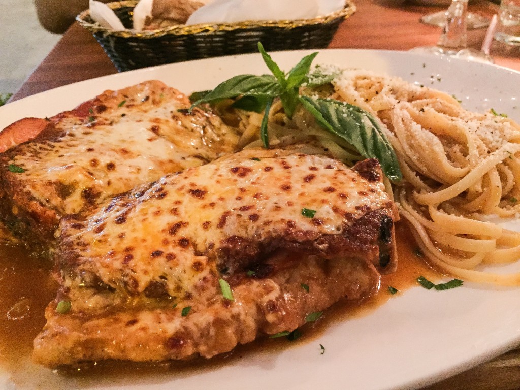  POLLO ALLA SORRENTINA  $ 18.99 Breast of chicken with  prosciutto and eggplant, sautéed in brown sauce and white wine, and topped with melted mozzarella