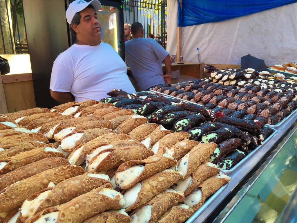 Cannolis! Buy them before that guy eats them all...