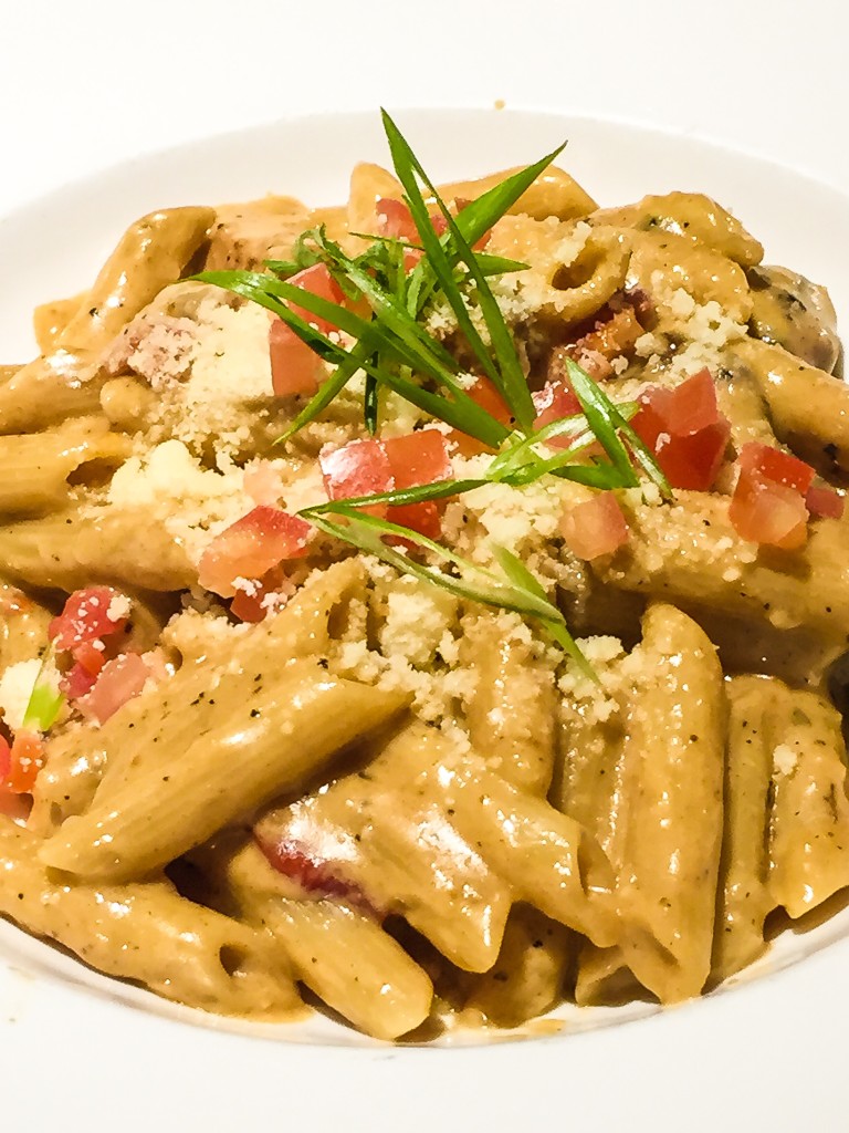 Cajun Chicken Alfredo - $22.50 Cajun-spiced blackened chicken breast, white wine, sun dried tomatoes, penne + creamy parmesan sauce.