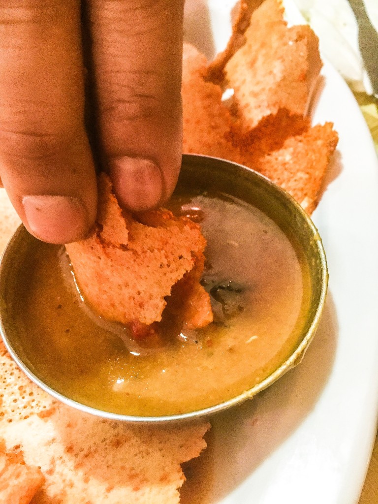 Dipping the Mysore Masala Dosa in....uh....something soupy. But Tasty!