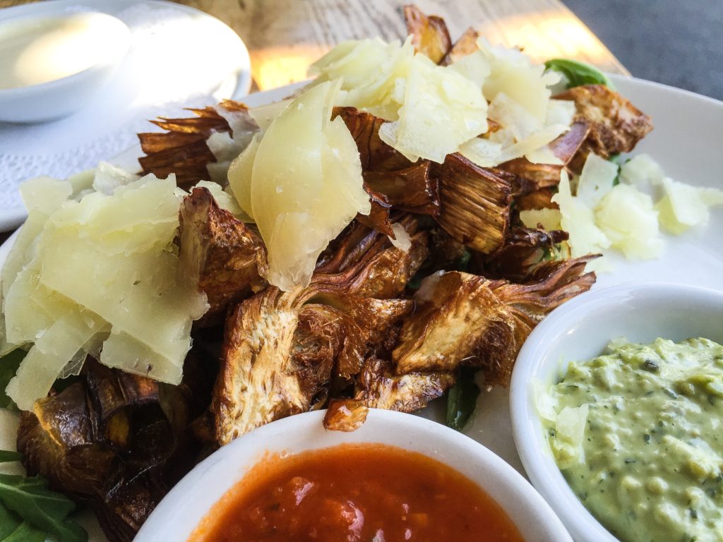 FRIED ARTICHOKE with shaved manchego, baby greens, two sauces 12