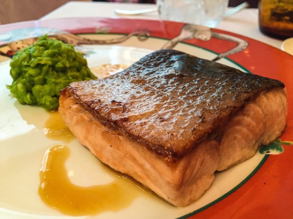 Salmon Green pea mash, orange and champagne dressing 