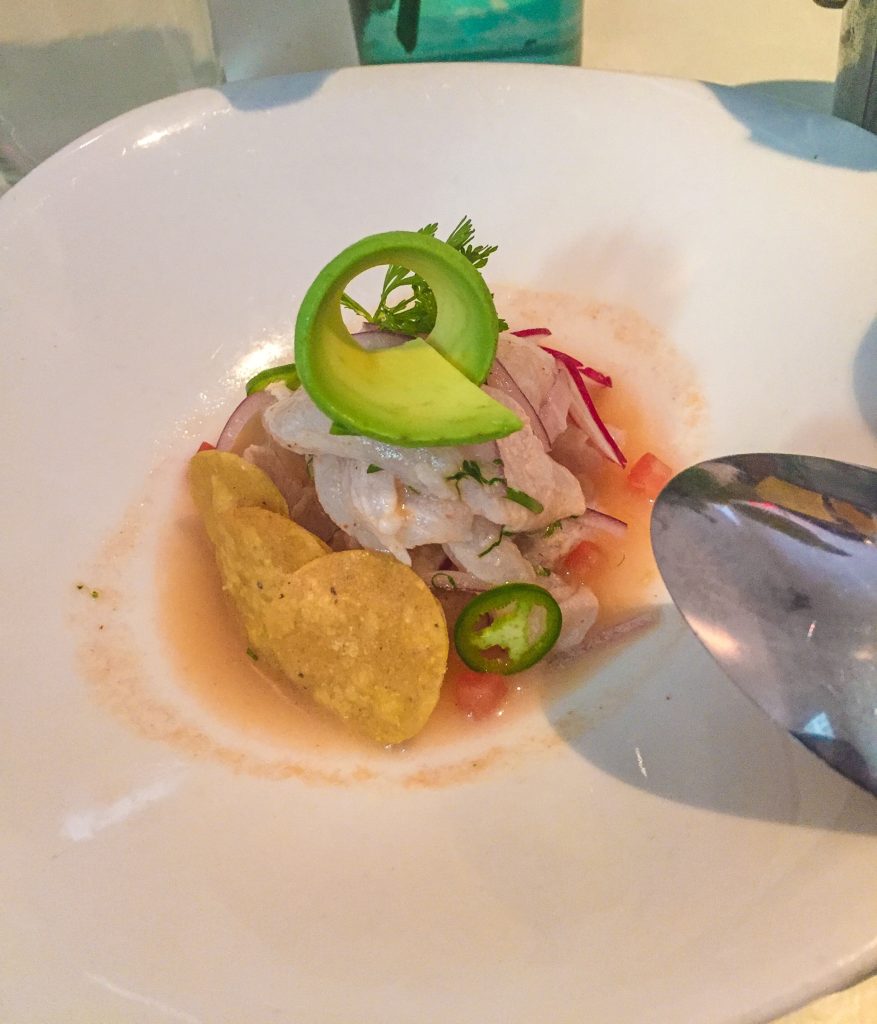 Ceviche de pescado - $18 Market fish cooked in lime, onion, avocado, tomato 